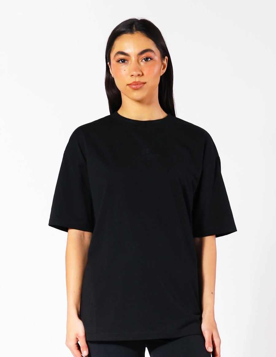 Russell Athletic Australia Women's Oversized Tonal Logo  Black Tee | Russell Athletic True Since 1902