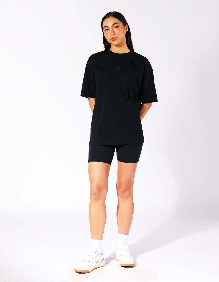 Russell Athletic Australia Women's Oversized Tonal Logo  Black Tee | Russell Athletic True Since 1902