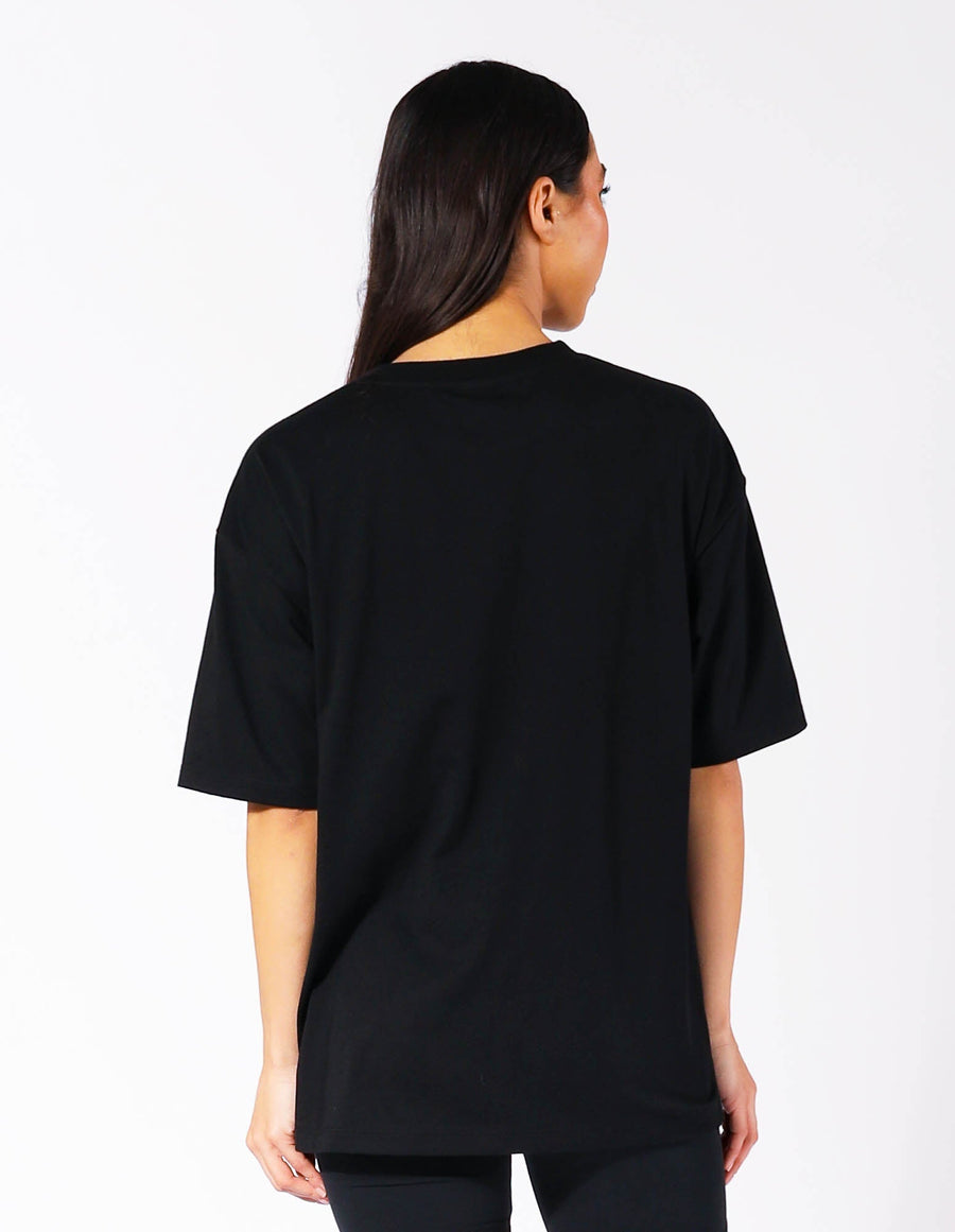 Russell Athletic Australia Women's Oversized Tonal Logo  Black Tee | Russell Athletic True Since 1902